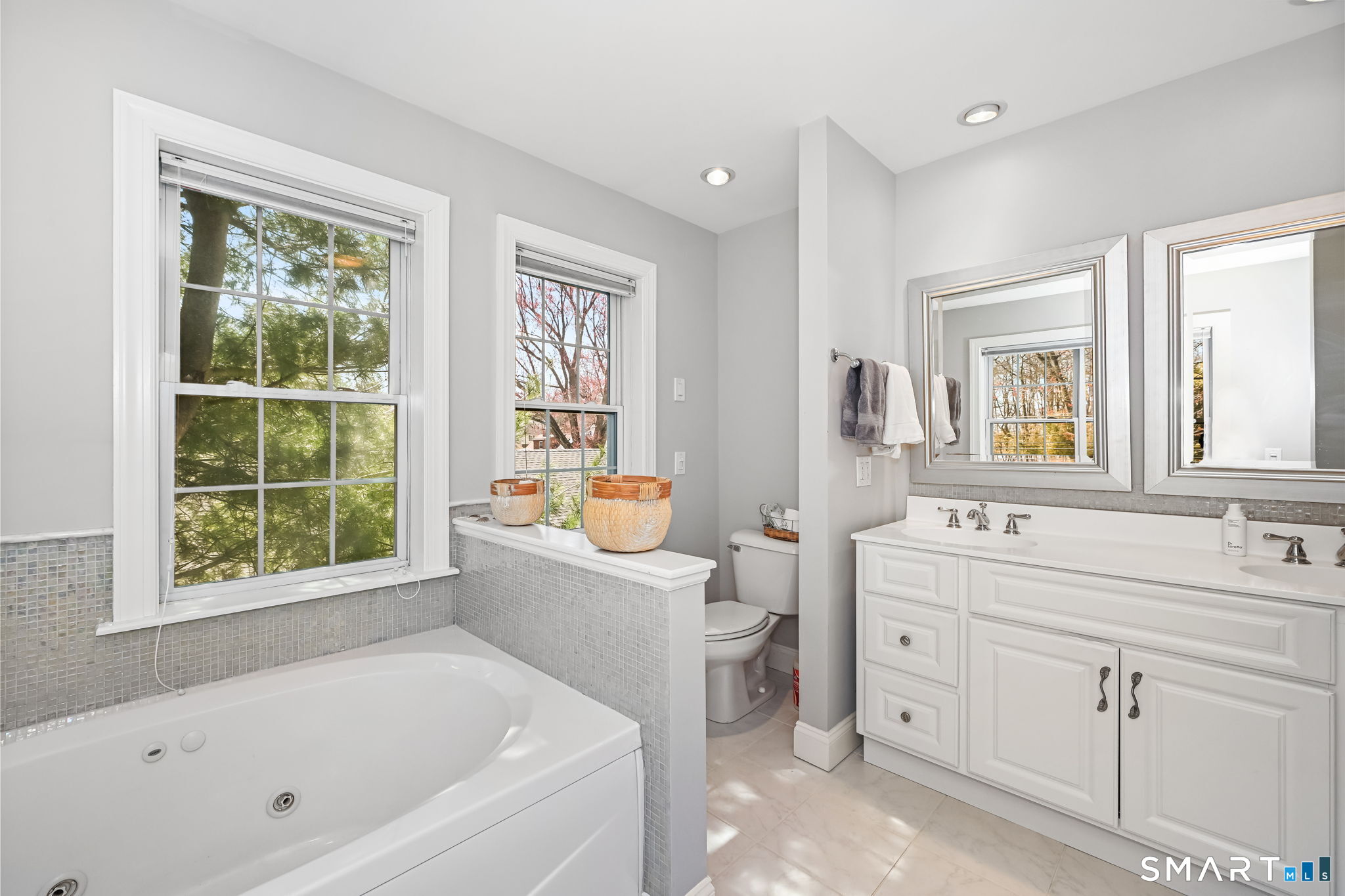 50 Berkeley Road Fairfield, CT 06825 - Photo 16 of 36 Primary bath with dual sinks and jetted tub.