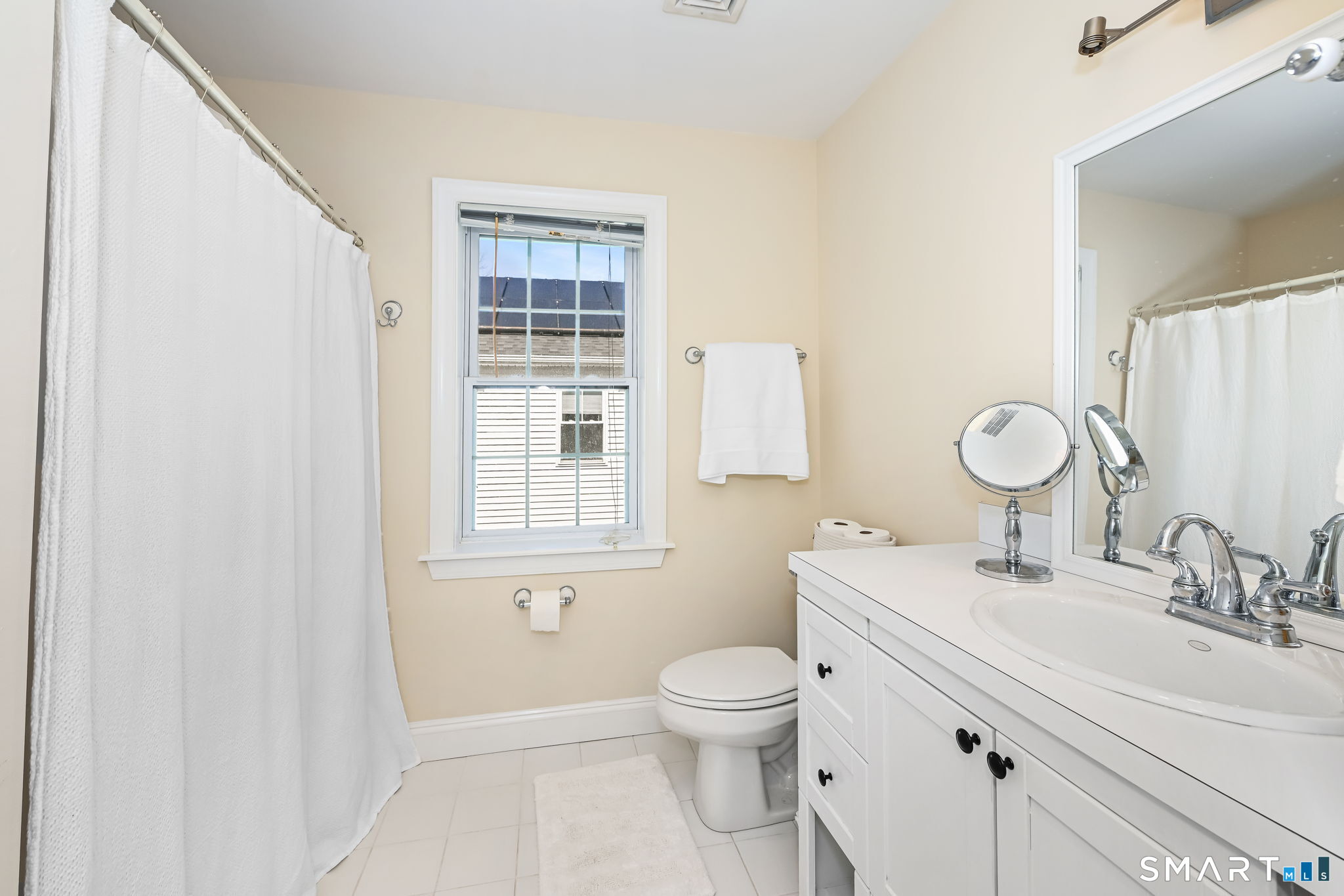 50 Berkeley Road Fairfield, CT 06825 - Photo 23 of 36 Full hall bathroom with shower/tub combination
