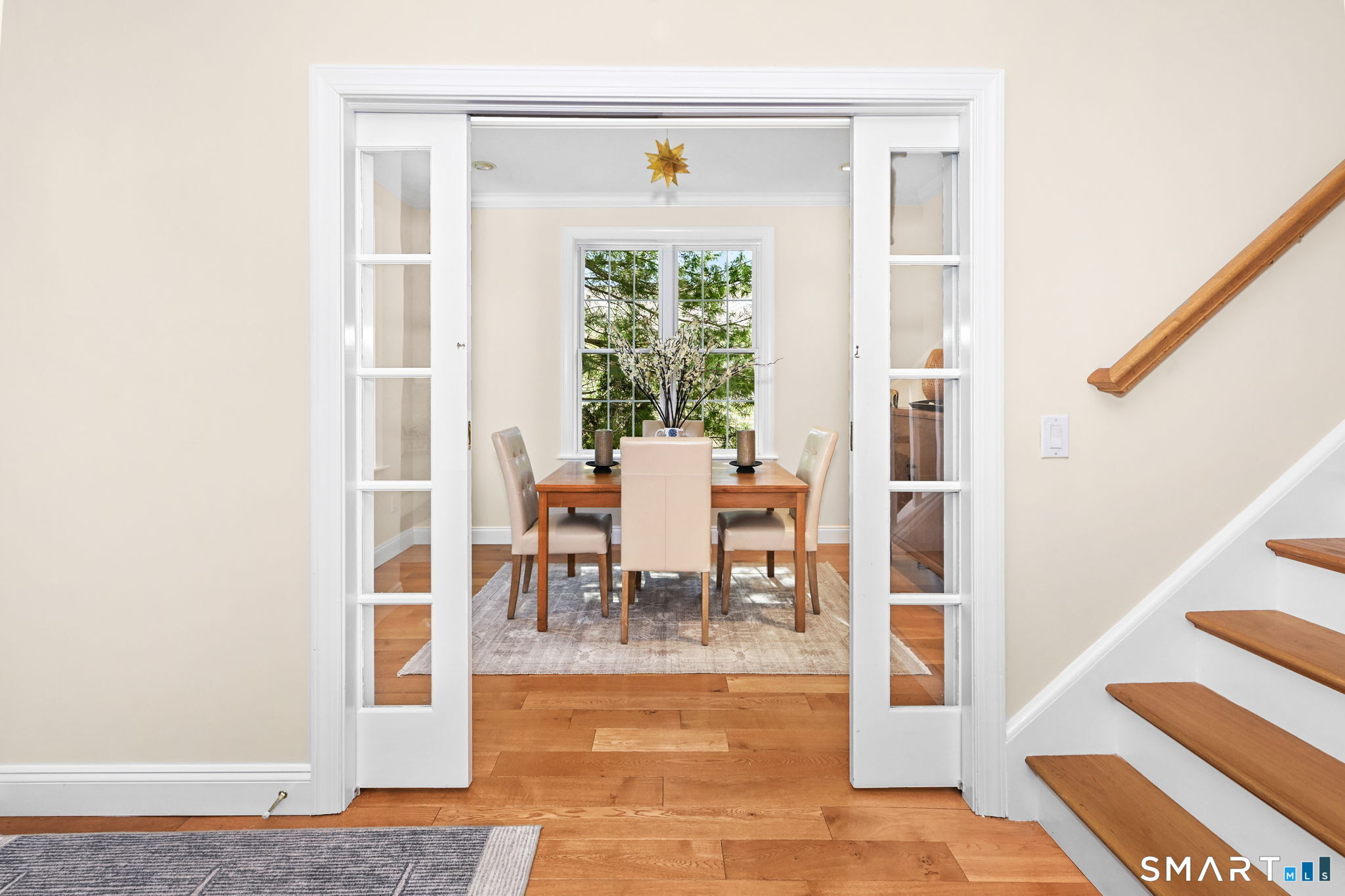 50 Berkeley Road Fairfield, CT 06825 - Photo 6 of 36 Gorgeous pocket doors lead to an elegant dining room