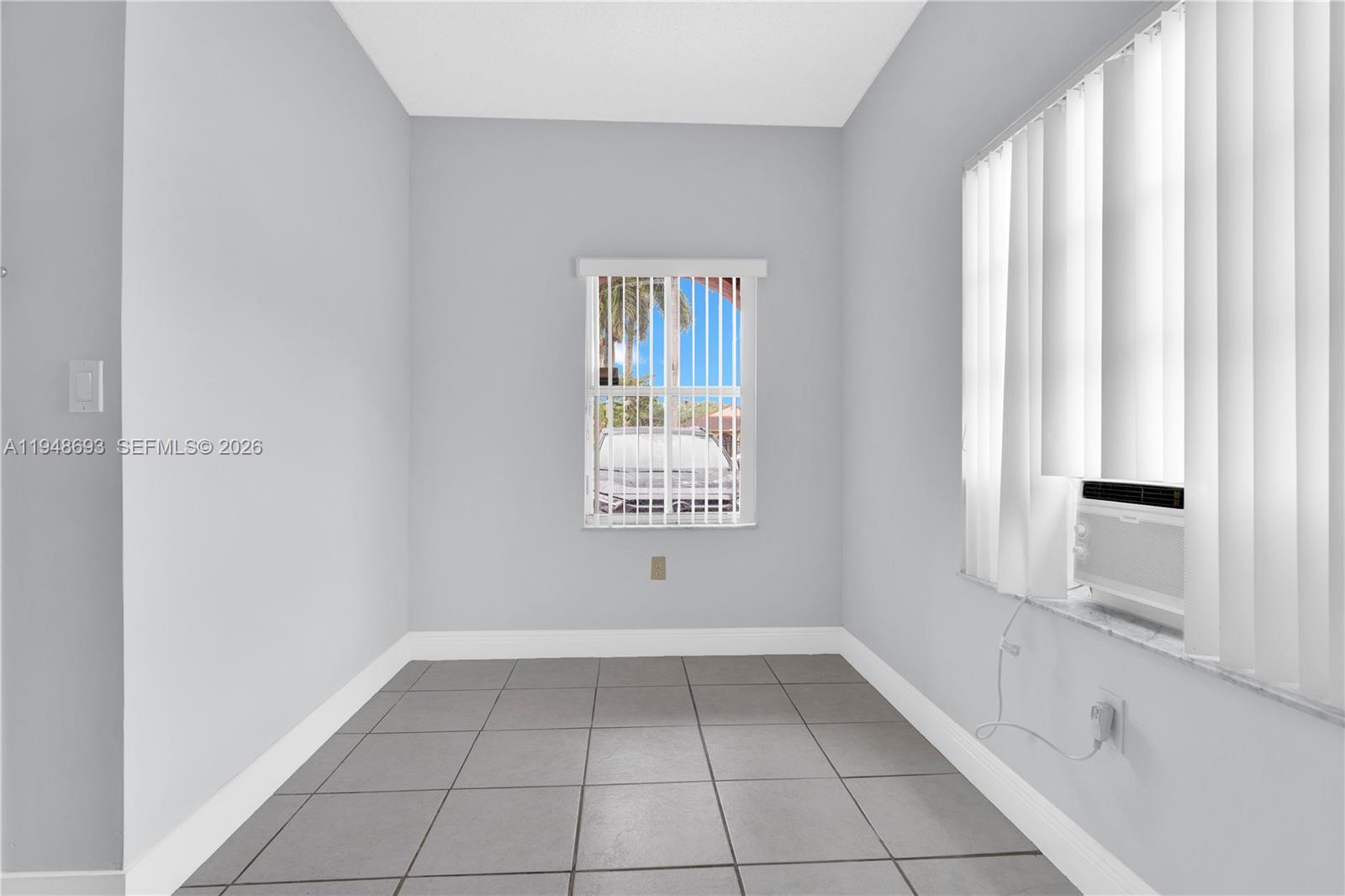 74 Northwest 2nd Street Homestead, FL 33030 - Photo 11 of 41 a view of an empty room with a window