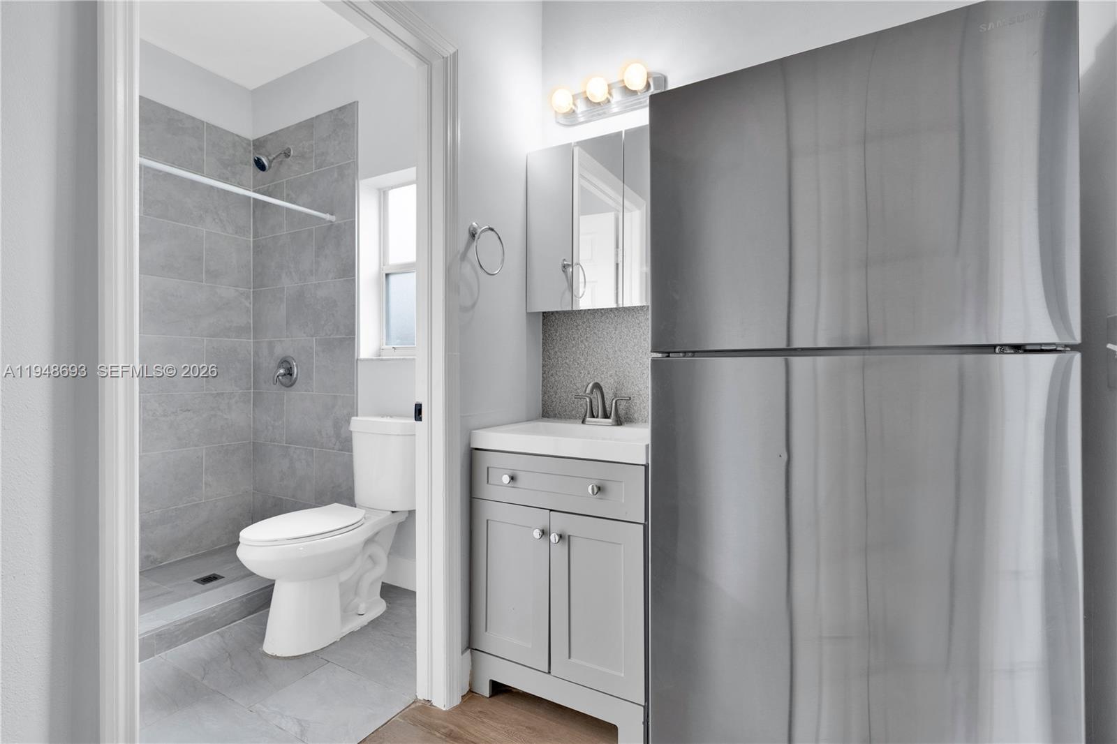 74 Northwest 2nd Street Homestead, FL 33030 - Photo 15 of 41 a bathroom with a sink a toilet and a shower