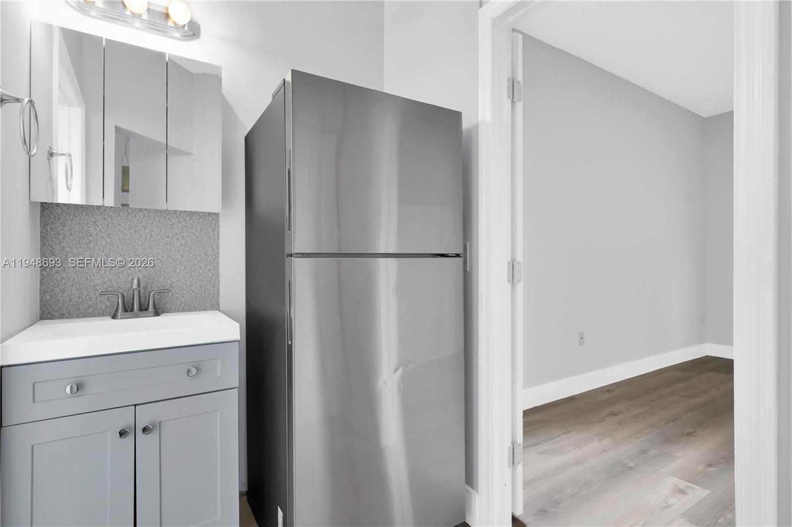 74 Northwest 2nd Street Homestead, FL 33030 - Photo 17 of 41 a white refrigerator freezer sitting inside of a kitchen
