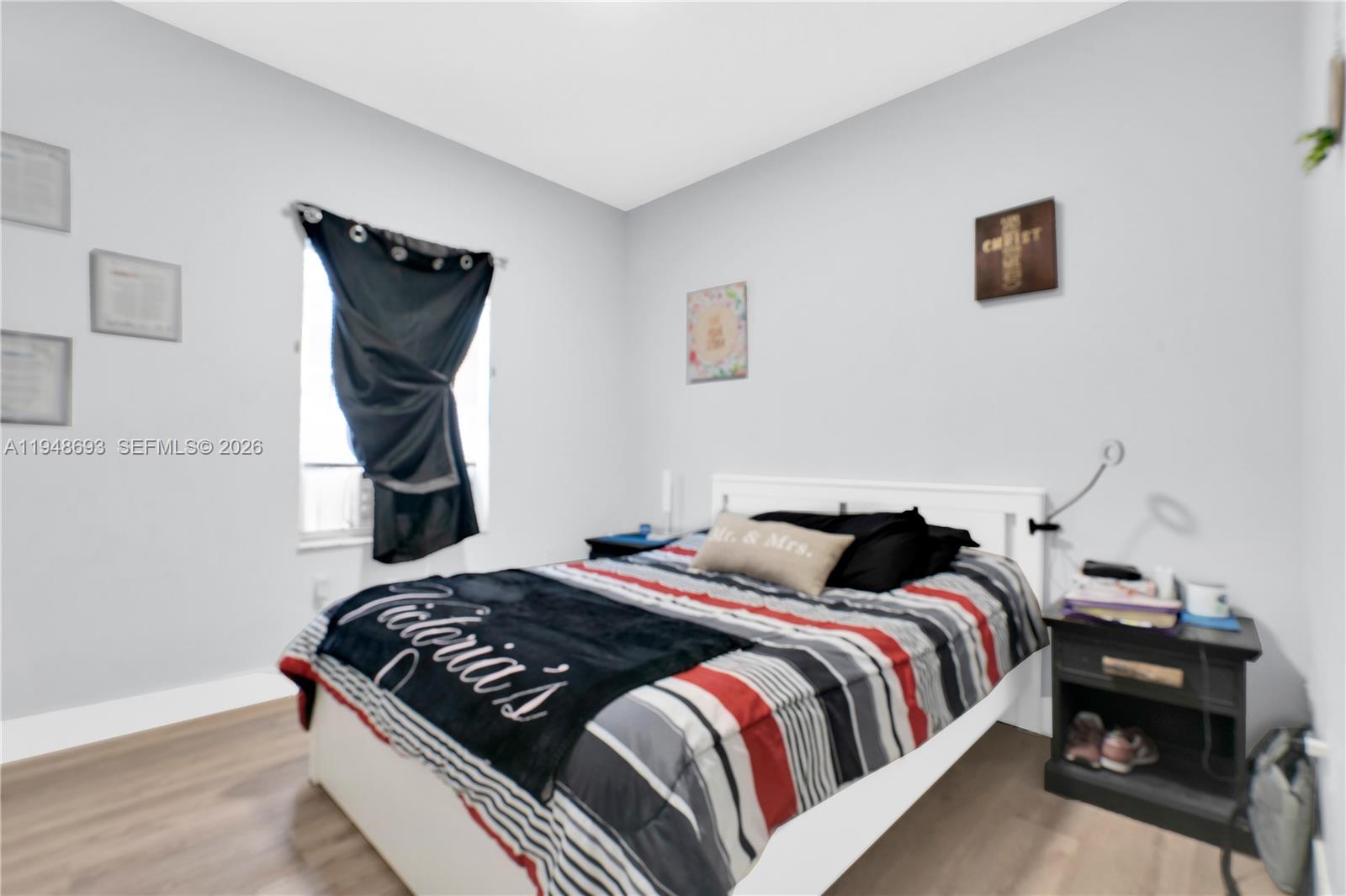 74 Northwest 2nd Street Homestead, FL 33030 - Photo 18 of 41 a bedroom with a bed and a window