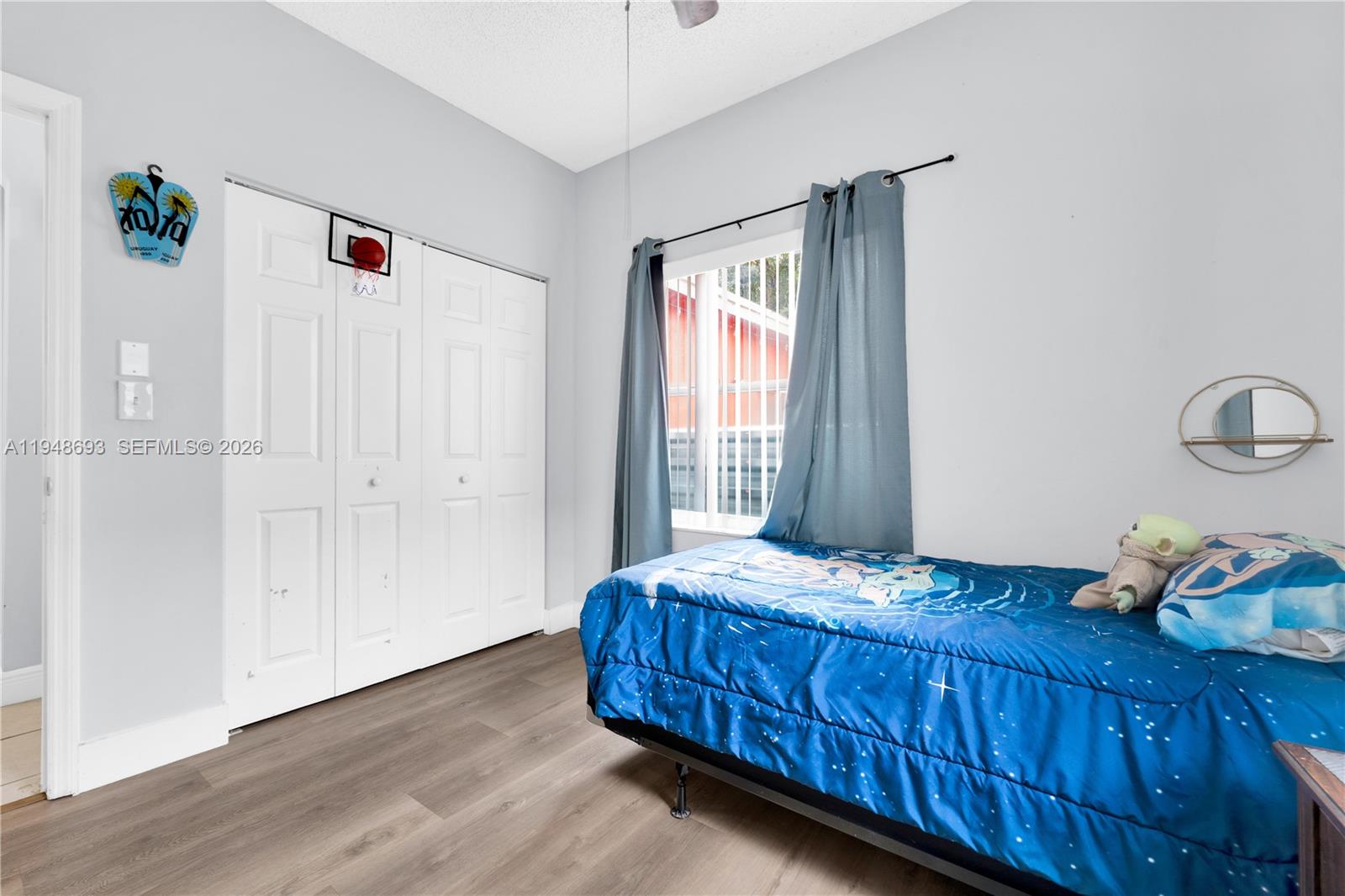 74 Northwest 2nd Street Homestead, FL 33030 - Photo 21 of 41 a bedroom with a bed and wooden floor