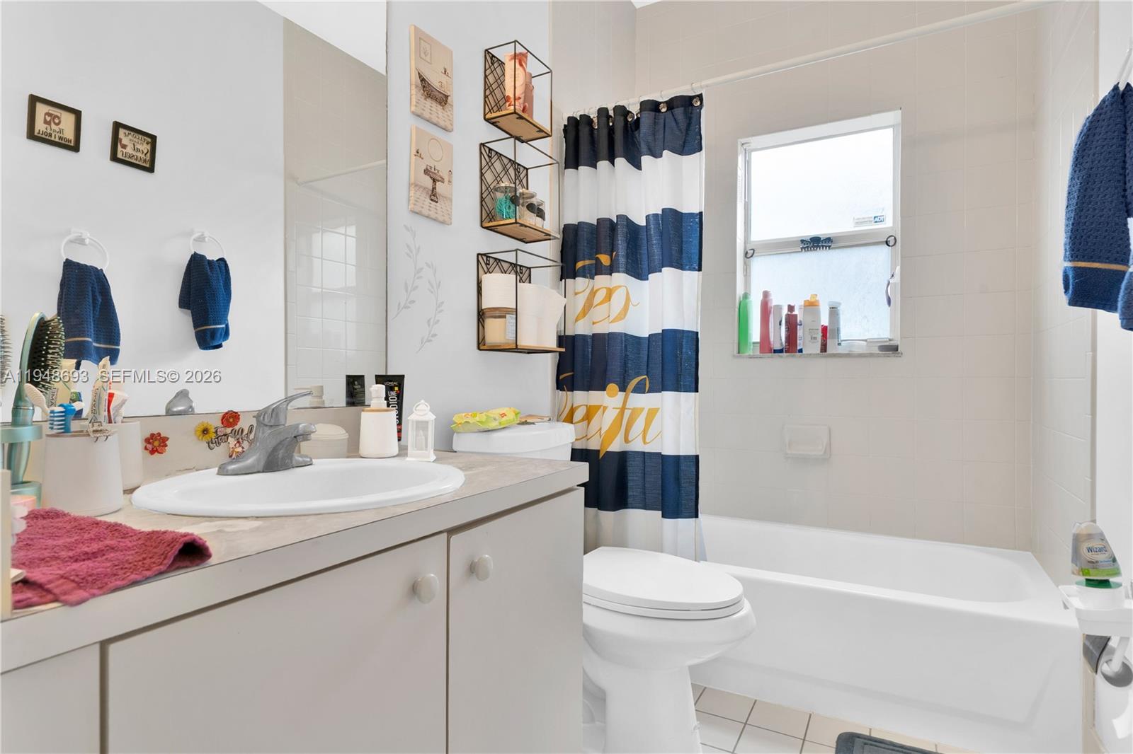 74 Northwest 2nd Street Homestead, FL 33030 - Photo 22 of 41 a bathroom with a sink vanity mirror bathtub and toilet