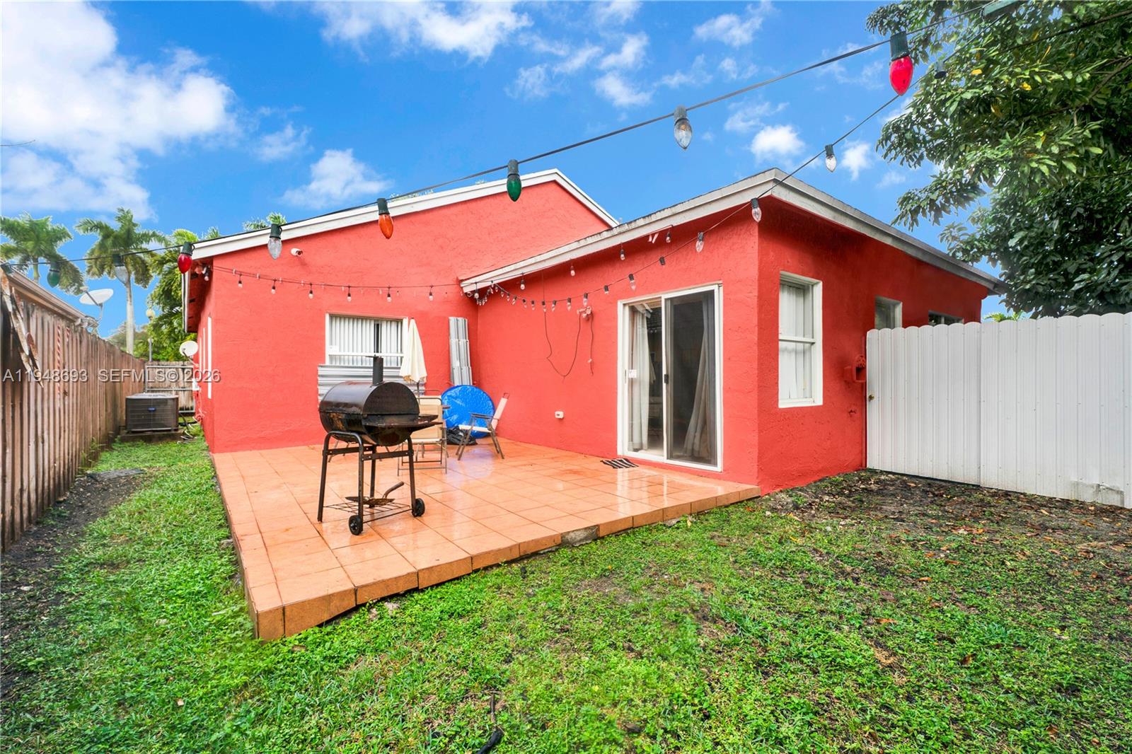 74 Northwest 2nd Street Homestead, FL 33030 - Photo 38 of 41 a backyard of a house with table and chairs