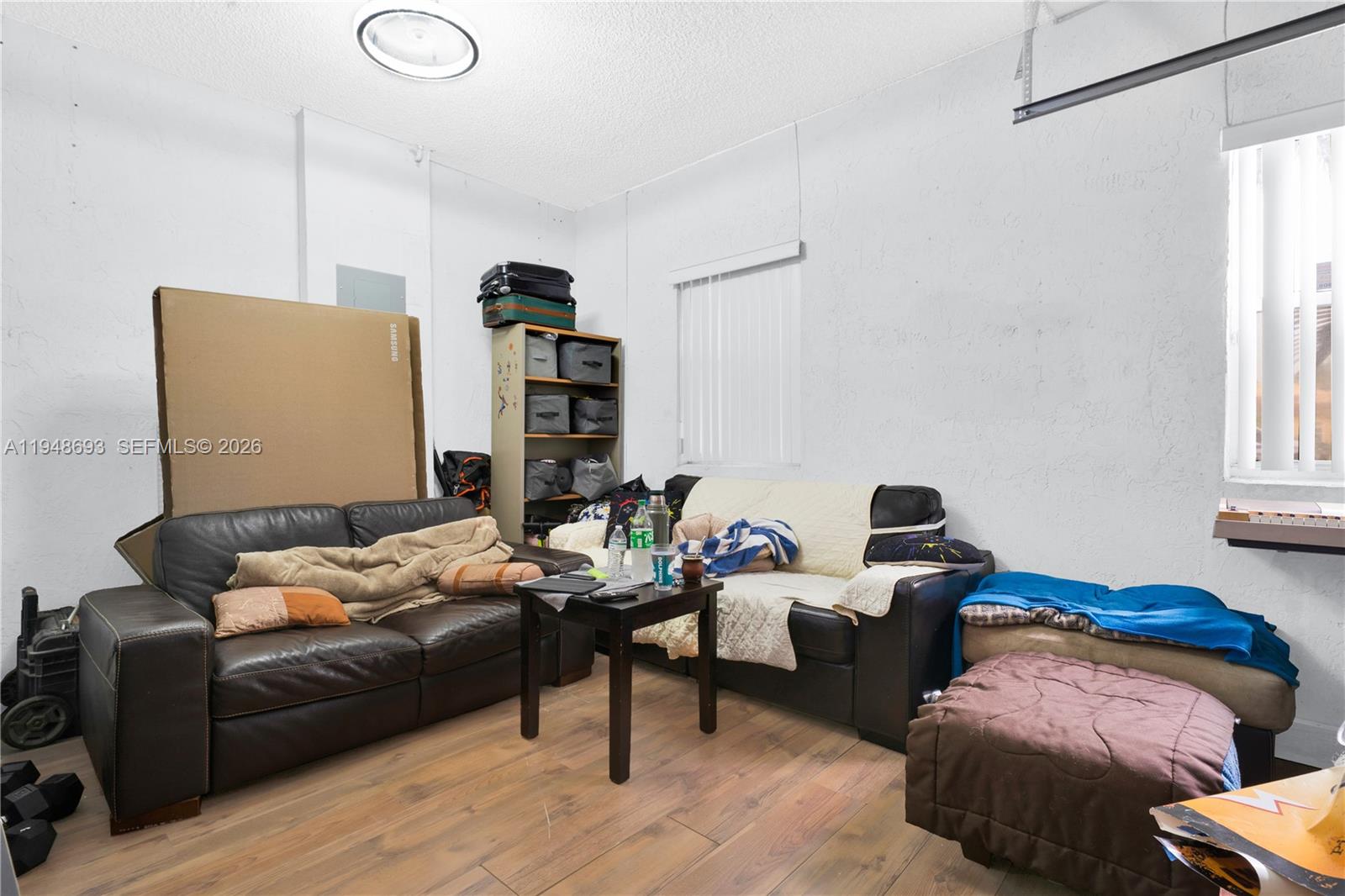 74 Northwest 2nd Street Homestead, FL 33030 - Photo 40 of 41 a living room with furniture wooden floor and window