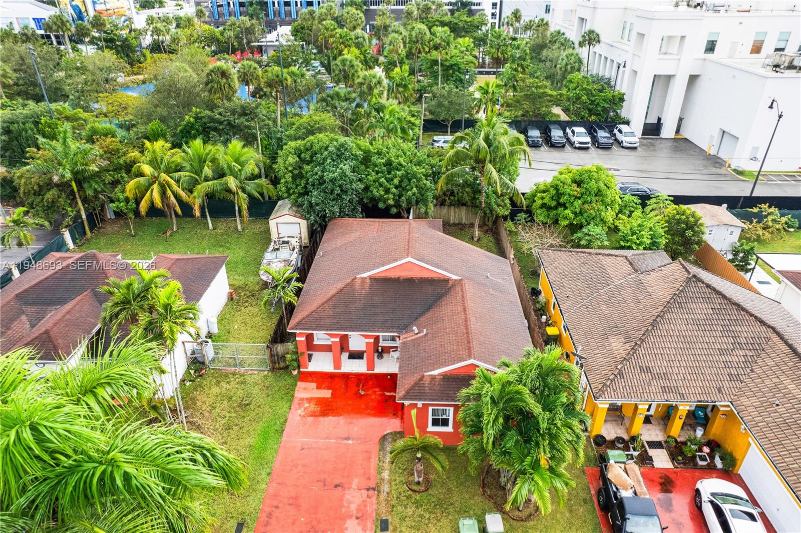 74 Northwest 2nd Street Homestead, FL 33030 - Photo 4 of 41 an aerial view of a house with swimming pool and garden