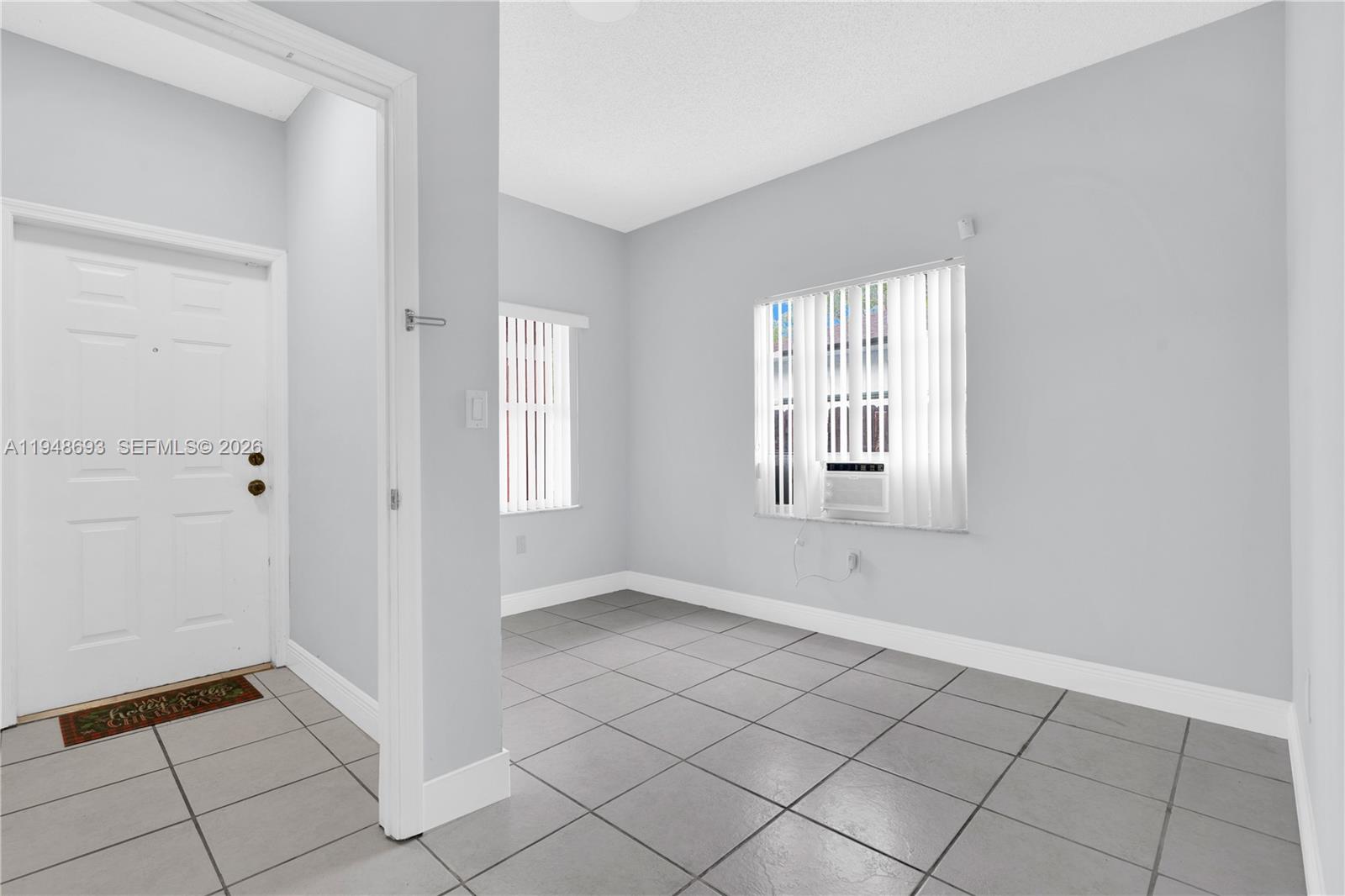 74 Northwest 2nd Street Homestead, FL 33030 - Photo 8 of 41 a view of an empty room with window