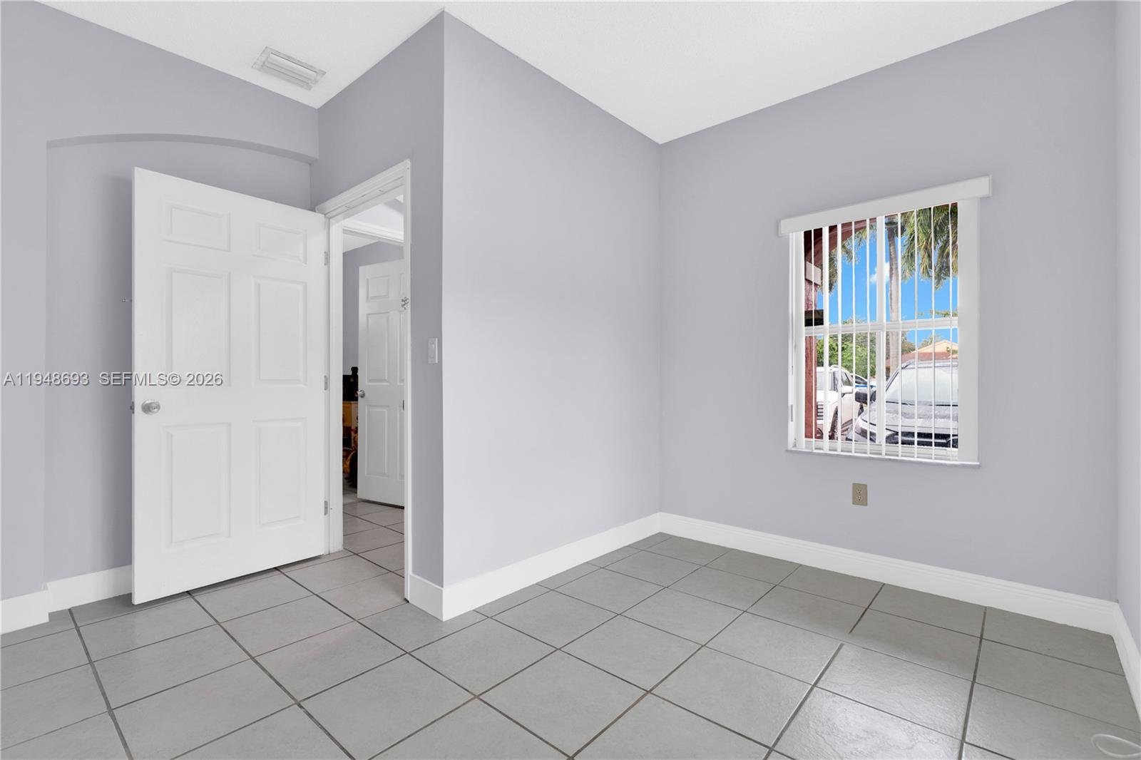 74 Northwest 2nd Street Homestead, FL 33030 - Photo 9 of 41 a view of an empty room with window