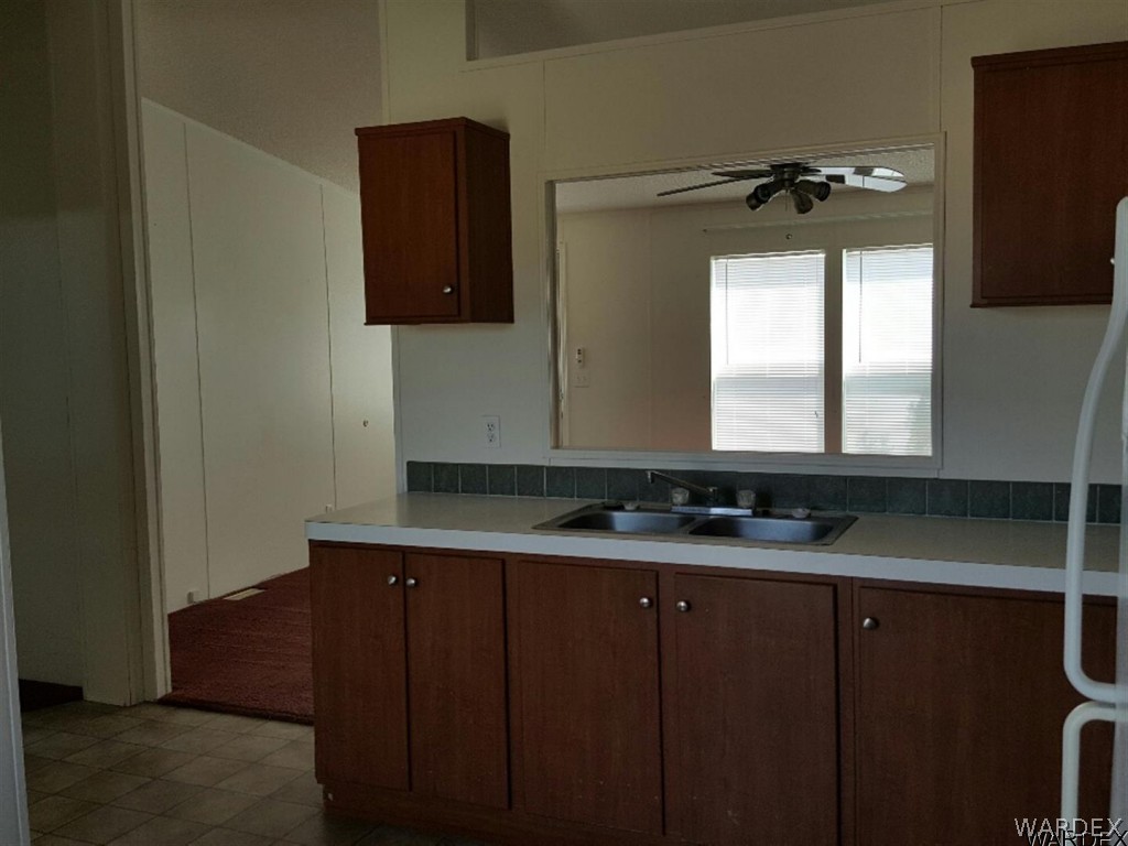1097 South Concho Road Golden Valley, AZ 86413 - Photo 11 of 20 a bathroom with a sink and a mirror