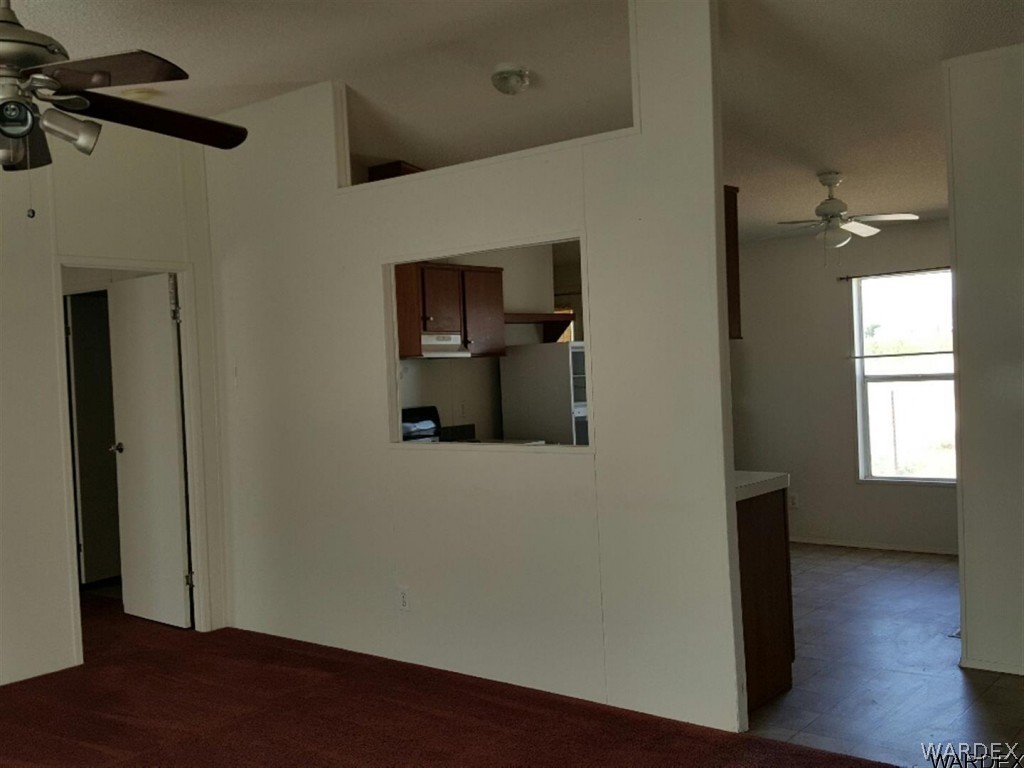 1097 South Concho Road Golden Valley, AZ 86413 - Photo 13 of 20 a view of empty room with wooden floor