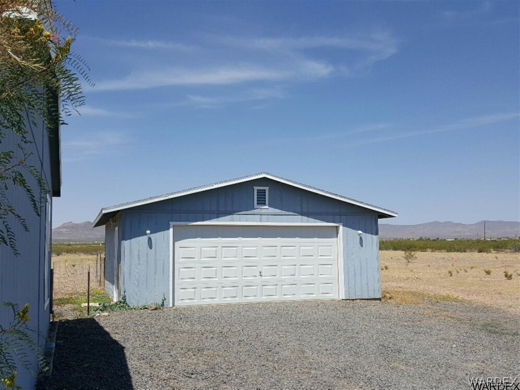 1097 South Concho Road Golden Valley, AZ 86413 - Photo 17 of 20 a front view of house with an outdoor space