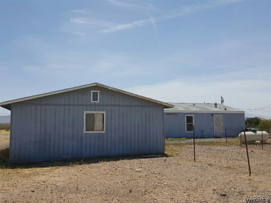 1097 South Concho Road Golden Valley, AZ 86413 - Photo 19 of 20 a front view of a house with a yard