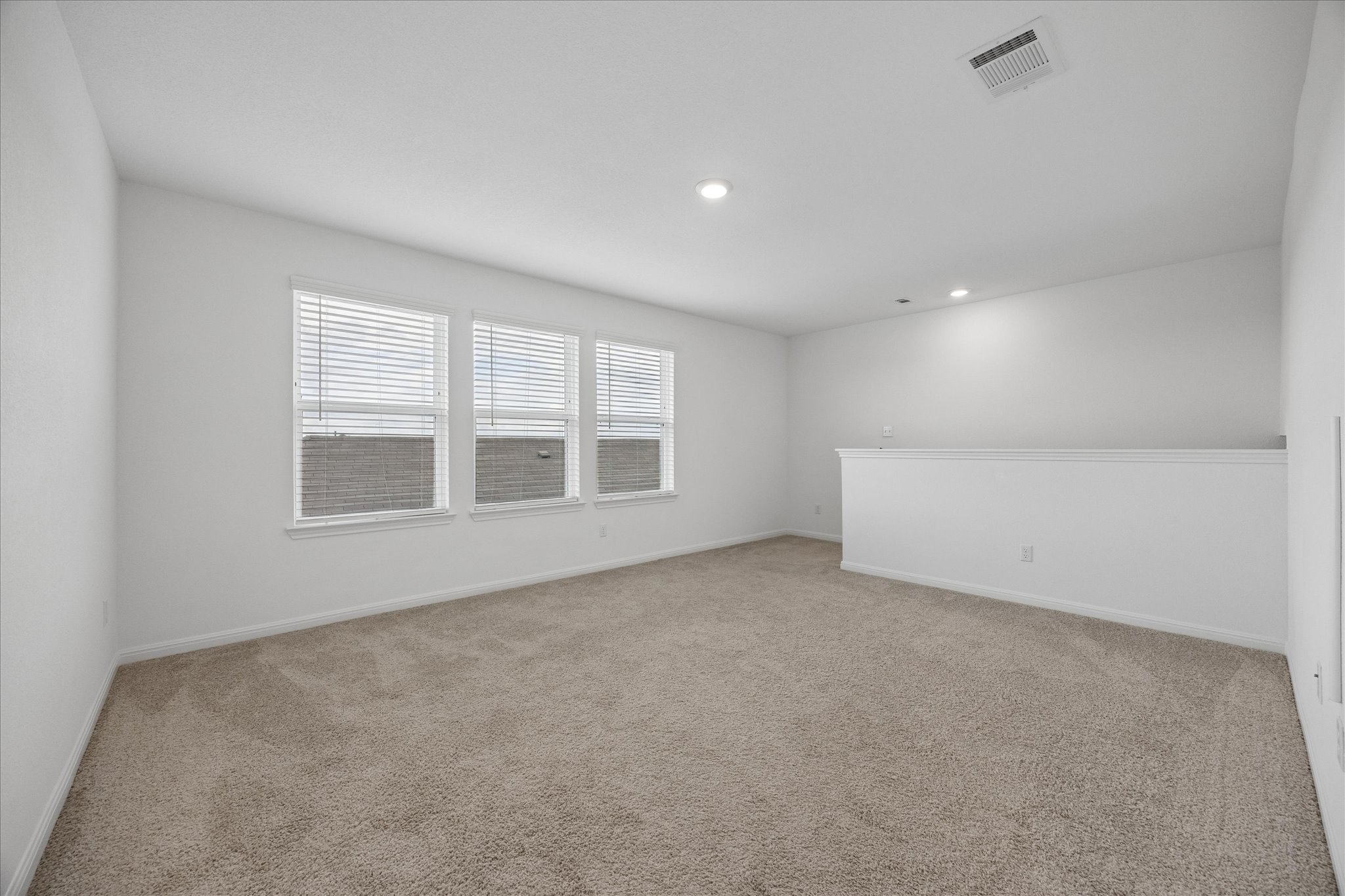 6407 Rounded Pebble Lane Buda, TX 78610 - Photo 20 of 32 A versatile secondary living space with ample natural light offers endless possibilities for relaxation or recreation.