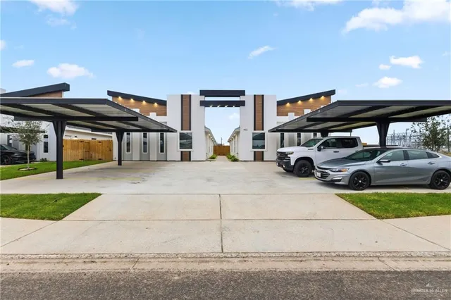 a view of a cars park in front of house