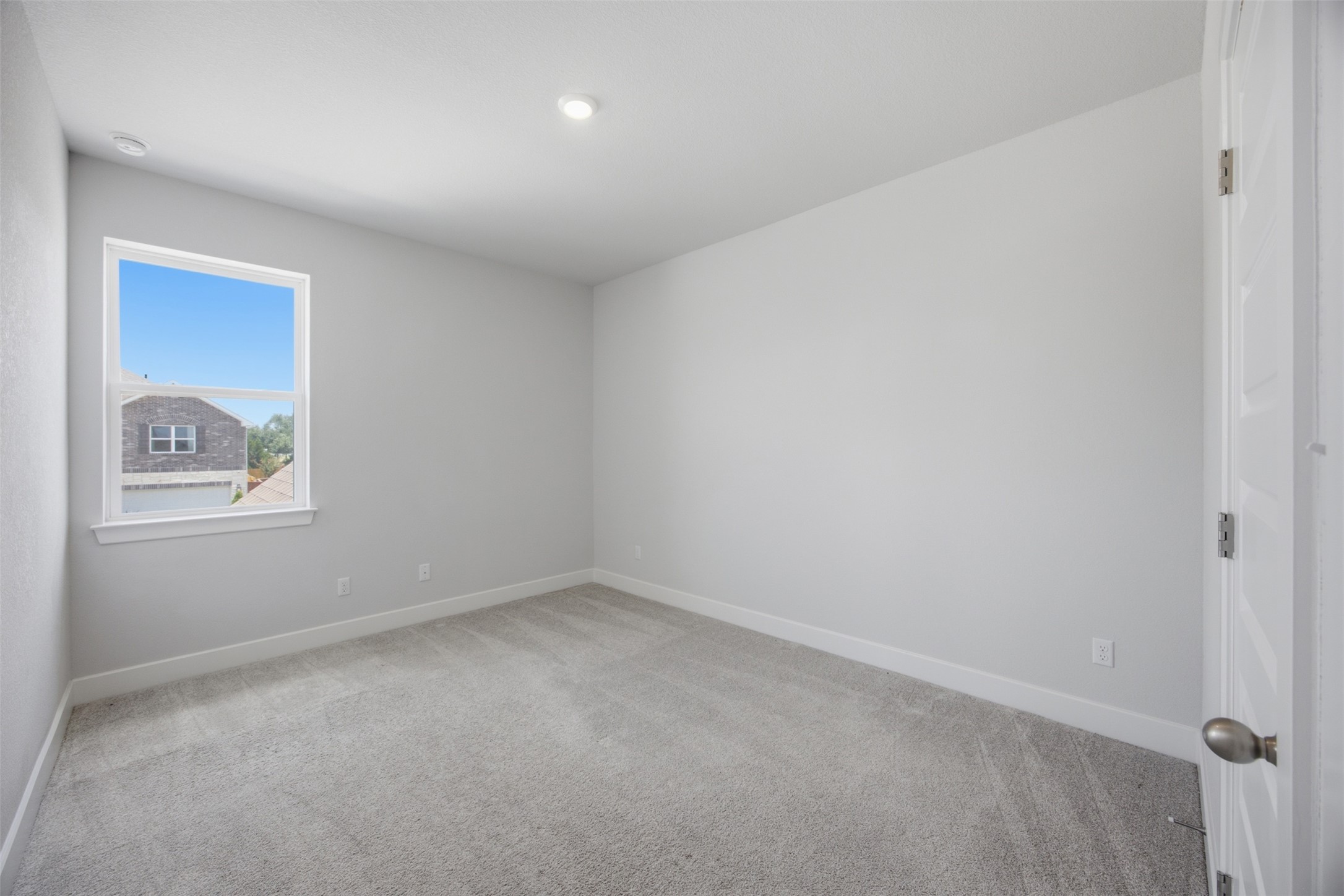 2101 Little Snake Way Georgetown, TX 78633 - Photo 29 of 37 A well-lit bedroom offering a serene and comfortable living space.