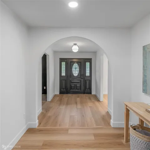 a living room with furniture and a tv