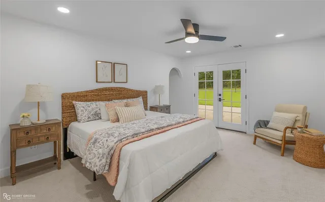 a bedroom with a bed and a chair