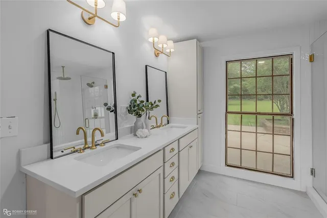 a bathroom with a sink and a mirror