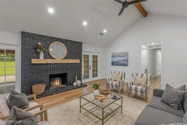 a living room with furniture and a fireplace