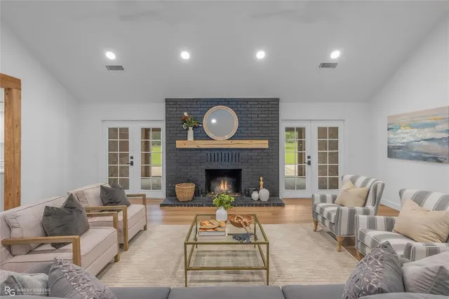 a living room with furniture and a fireplace