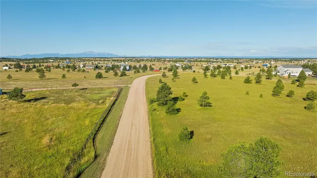 a view of a swimming pool and an outdoor space