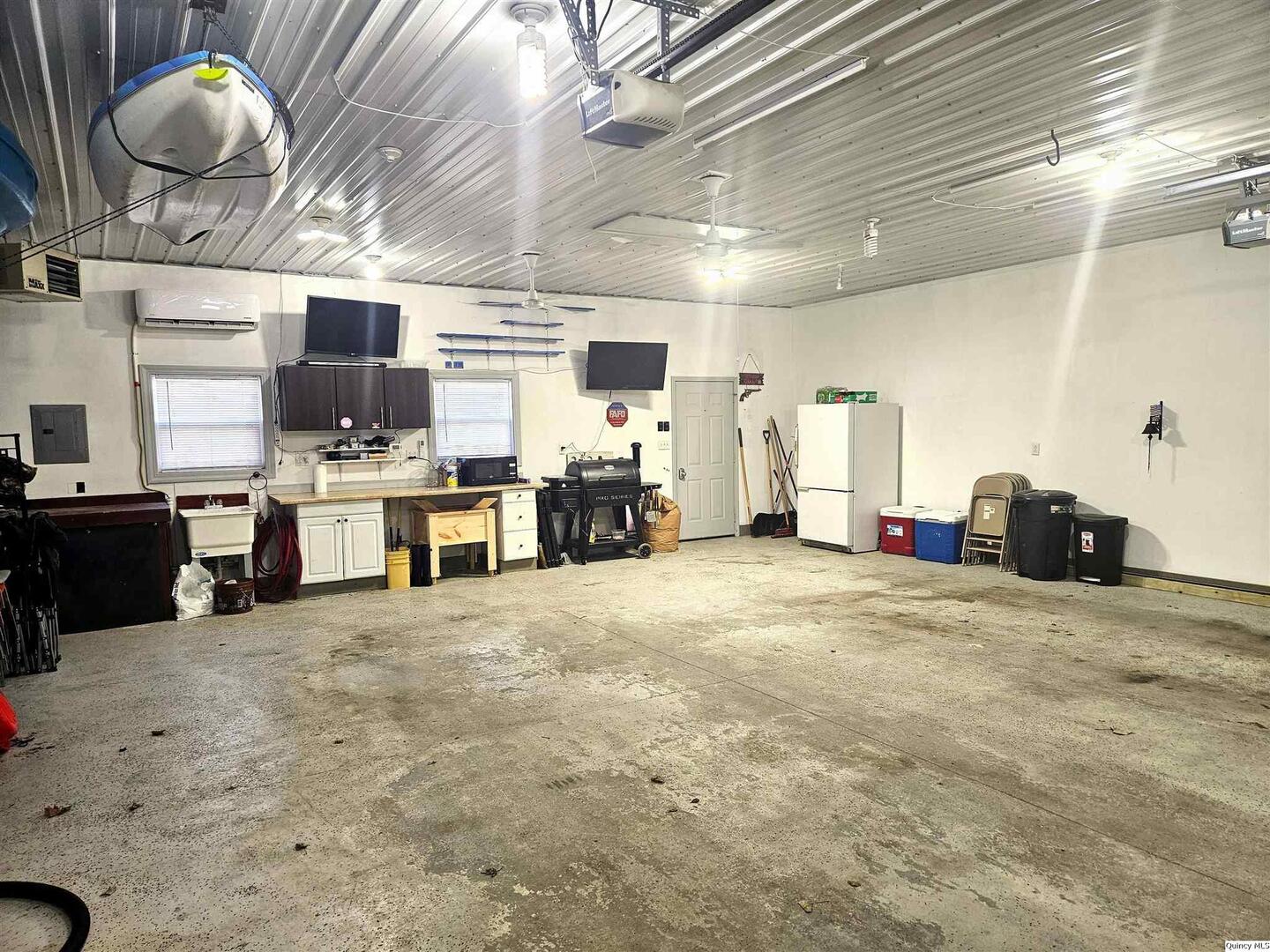 1520 Spruce Street Quincy, IL 62301 - Photo 21 of 21 a large kitchen with a table and chairs