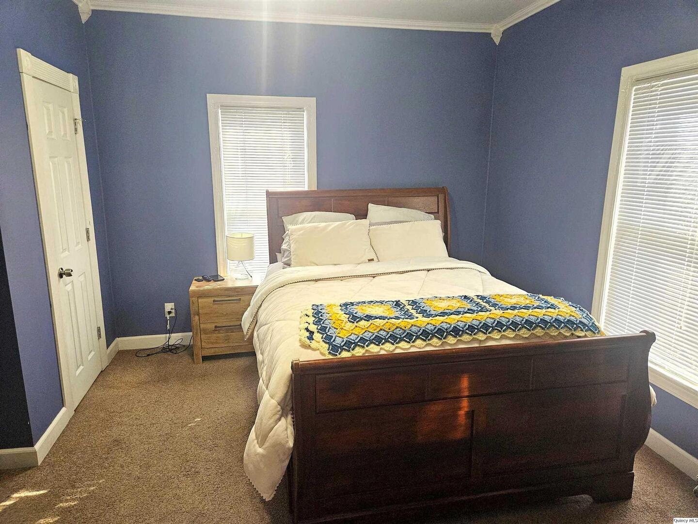 1520 Spruce Street Quincy, IL 62301 - Photo 8 of 21 a bedroom with a bed and window