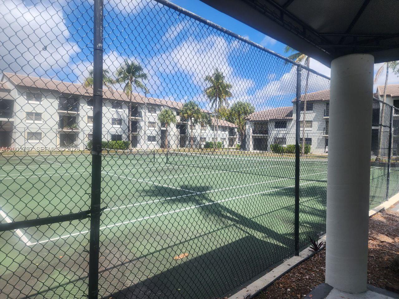 7220 Northwest 179th Street, Unit 111 Hialeah, FL 33015 - Photo 12 of 12 a view of a house with a floor to ceiling window