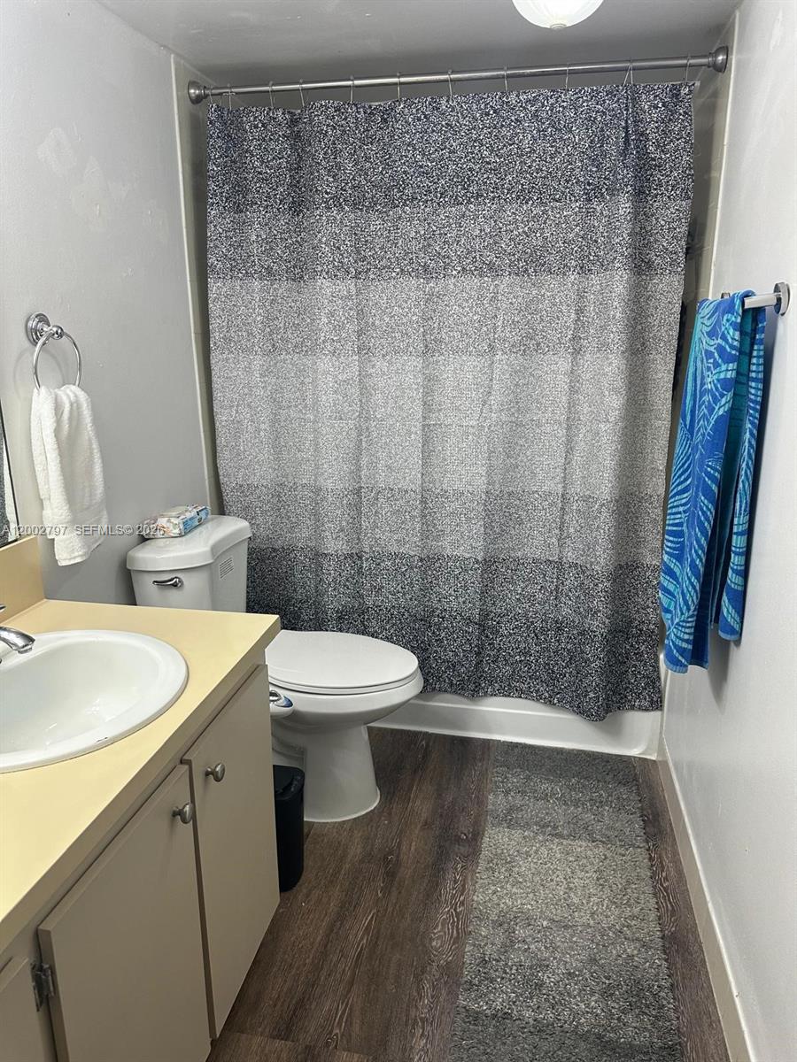 7220 Northwest 179th Street, Unit 111 Hialeah, FL 33015 - Photo 5 of 12 a bathroom with a sink and toilet