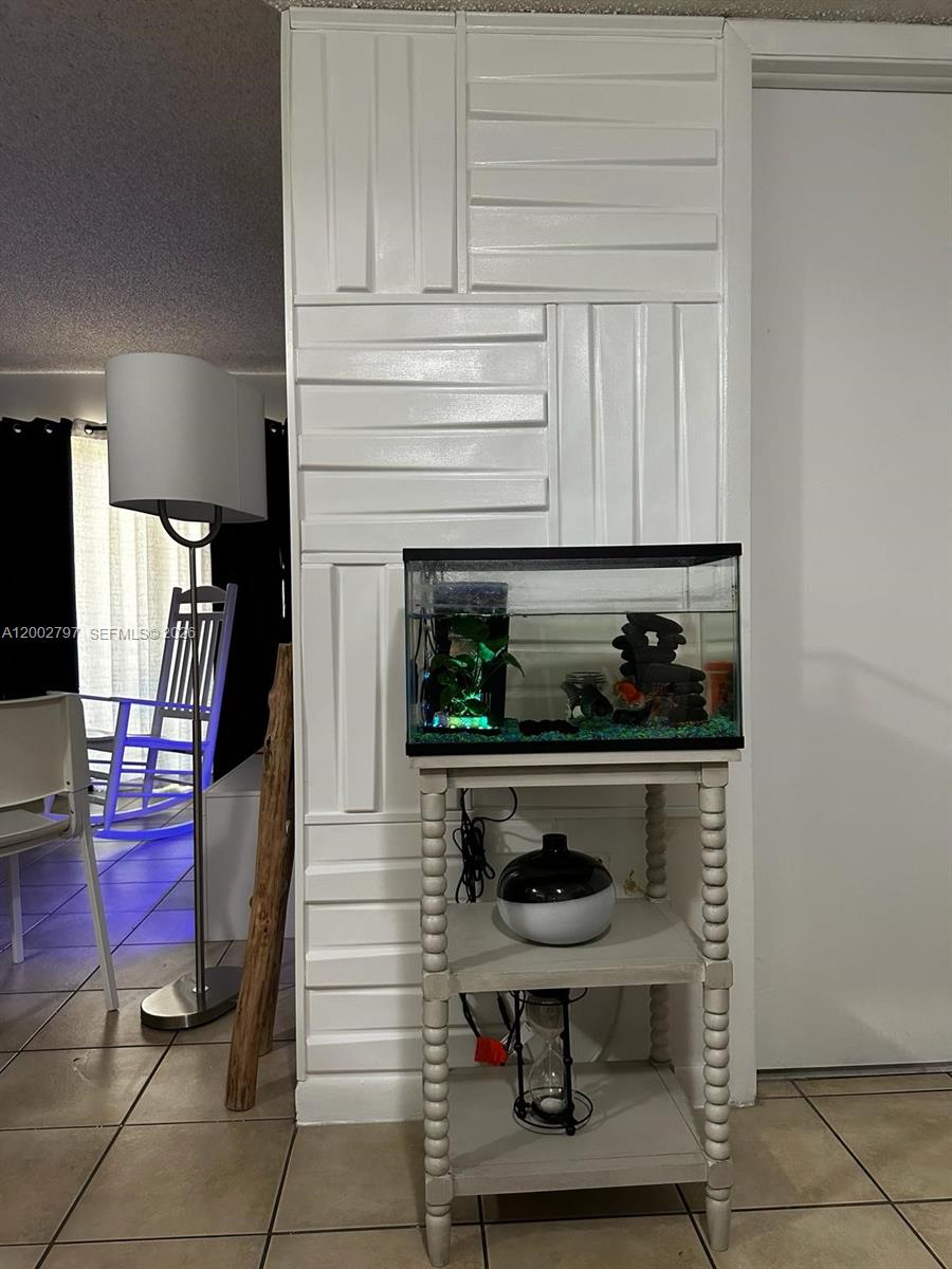 7220 Northwest 179th Street, Unit 111 Hialeah, FL 33015 - Photo 7 of 12 a kitchen with a stove and cabinets