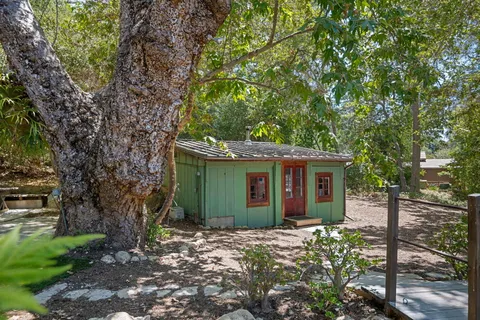 a view of a house with a garden