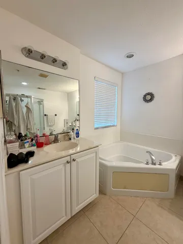 a view of a bathroom sink mirror and