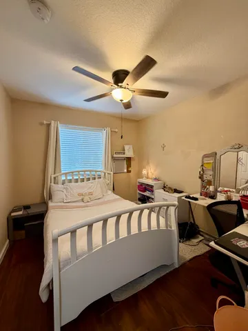 a living room with furniture and flat screen tv