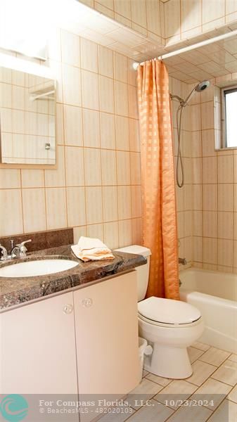 3322 Coolidge Street Hollywood, FL 33021 - Photo 19 of 32 a bathroom with a granite countertop sink a toilet and shower