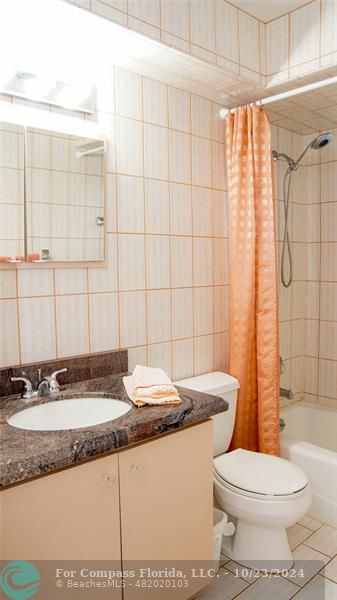 3322 Coolidge Street Hollywood, FL 33021 - Photo 20 of 32 a bathroom with a granite countertop sink toilet and shower