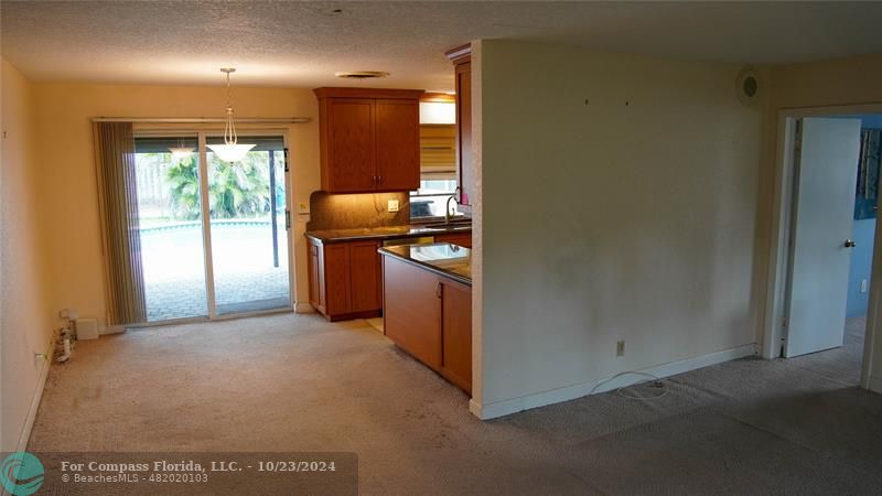 3322 Coolidge Street Hollywood, FL 33021 - Photo 3 of 32 a kitchen with stainless steel appliances granite countertop cabinets and window
