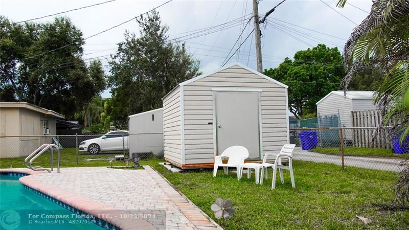 3322 Coolidge Street Hollywood, FL 33021 - Photo 32 of 32 a view of a white house with a yard and sitting area