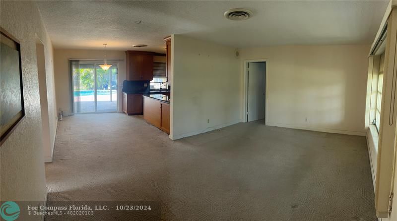 3322 Coolidge Street Hollywood, FL 33021 - Photo 4 of 32 a view of a hallway with kitchen and window