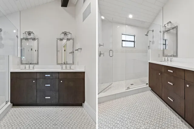 a bathroom with a sink double vanity granite tub shower and a mirror