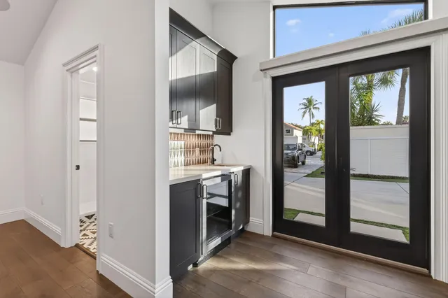 a view of walk in closet with clothes and a window