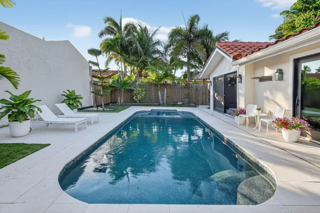 a lobby with a table and chairs