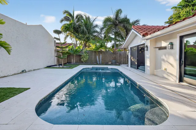 a front view of a house with swimming pool