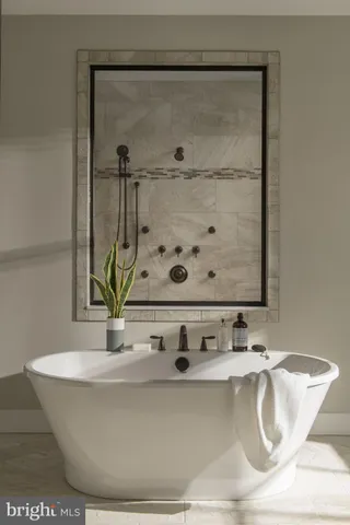 a white bath tub sitting in a bathroom