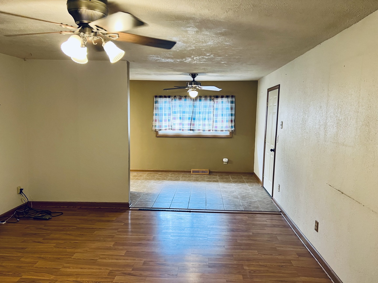 316 Erickson Road Rochelle, IL 61068 - Photo 5 of 17 a view of an empty room with window and wooden floor