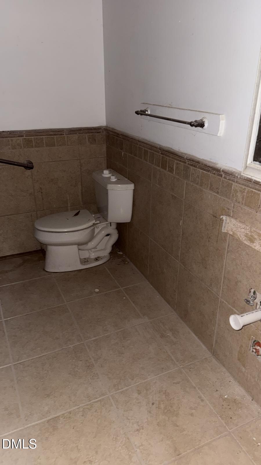 4212 Converse Drive Raleigh, NC 27609 - Photo 14 of 32 a bathroom with a toilet and a shower