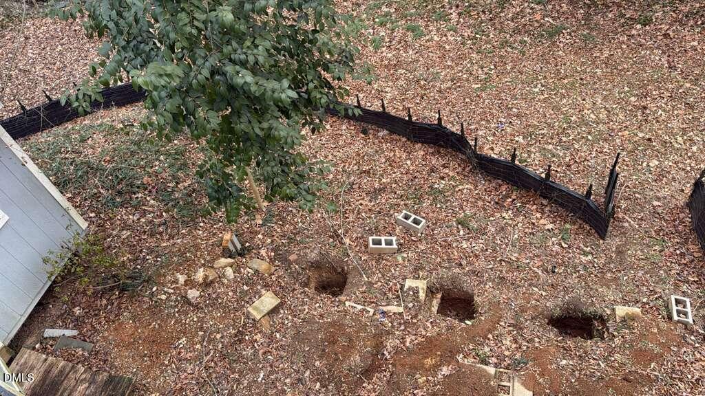 4212 Converse Drive Raleigh, NC 27609 - Photo 27 of 32 a view of a yard with plants and trees