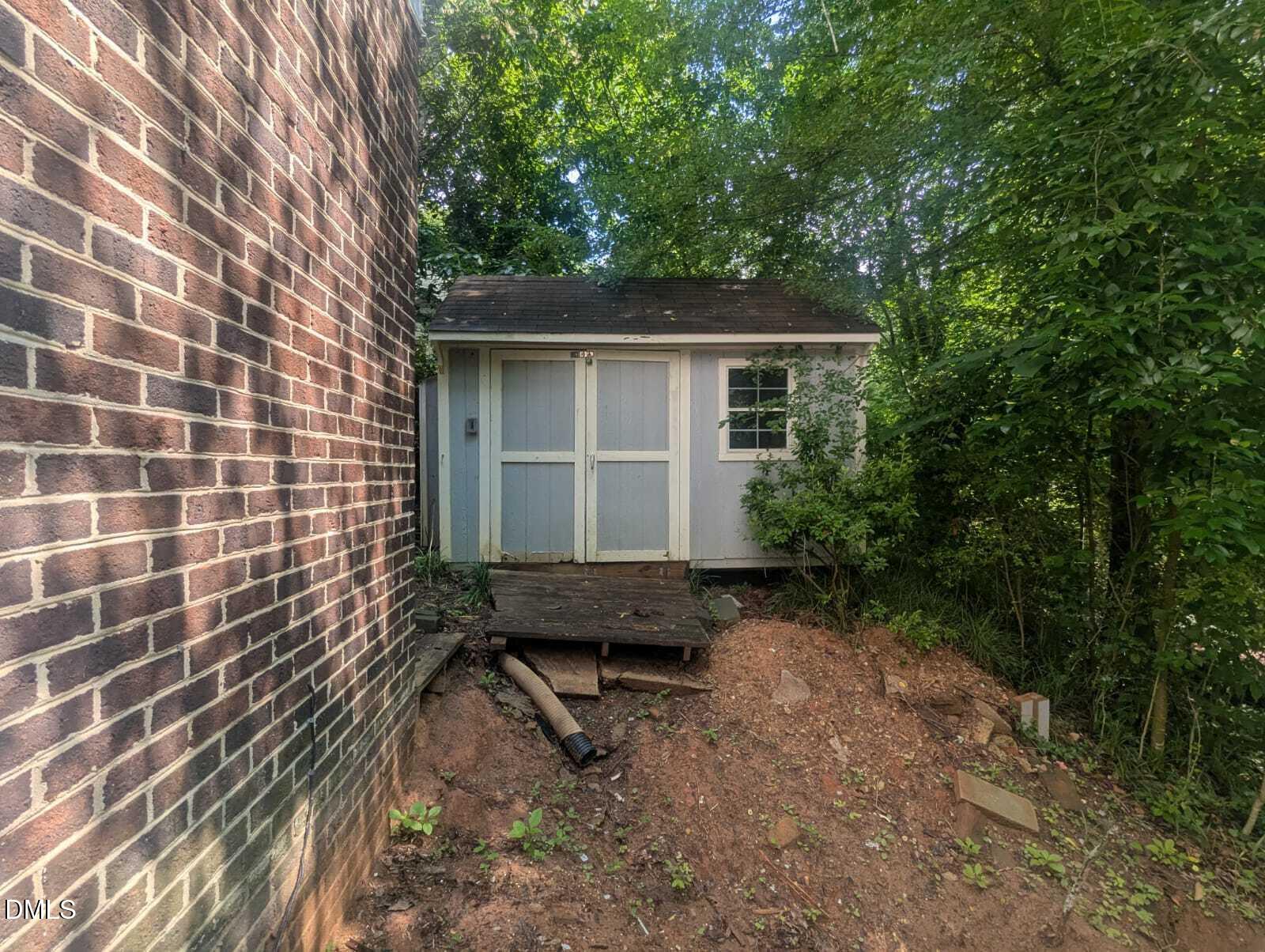 4212 Converse Drive Raleigh, NC 27609 - Photo 4 of 32 a backyard of a house with trees