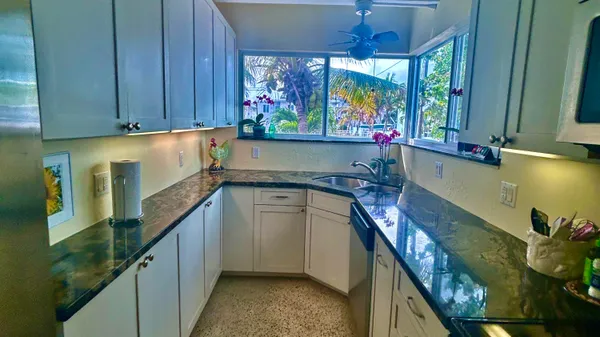 a view of swimming pool with a garden and trees